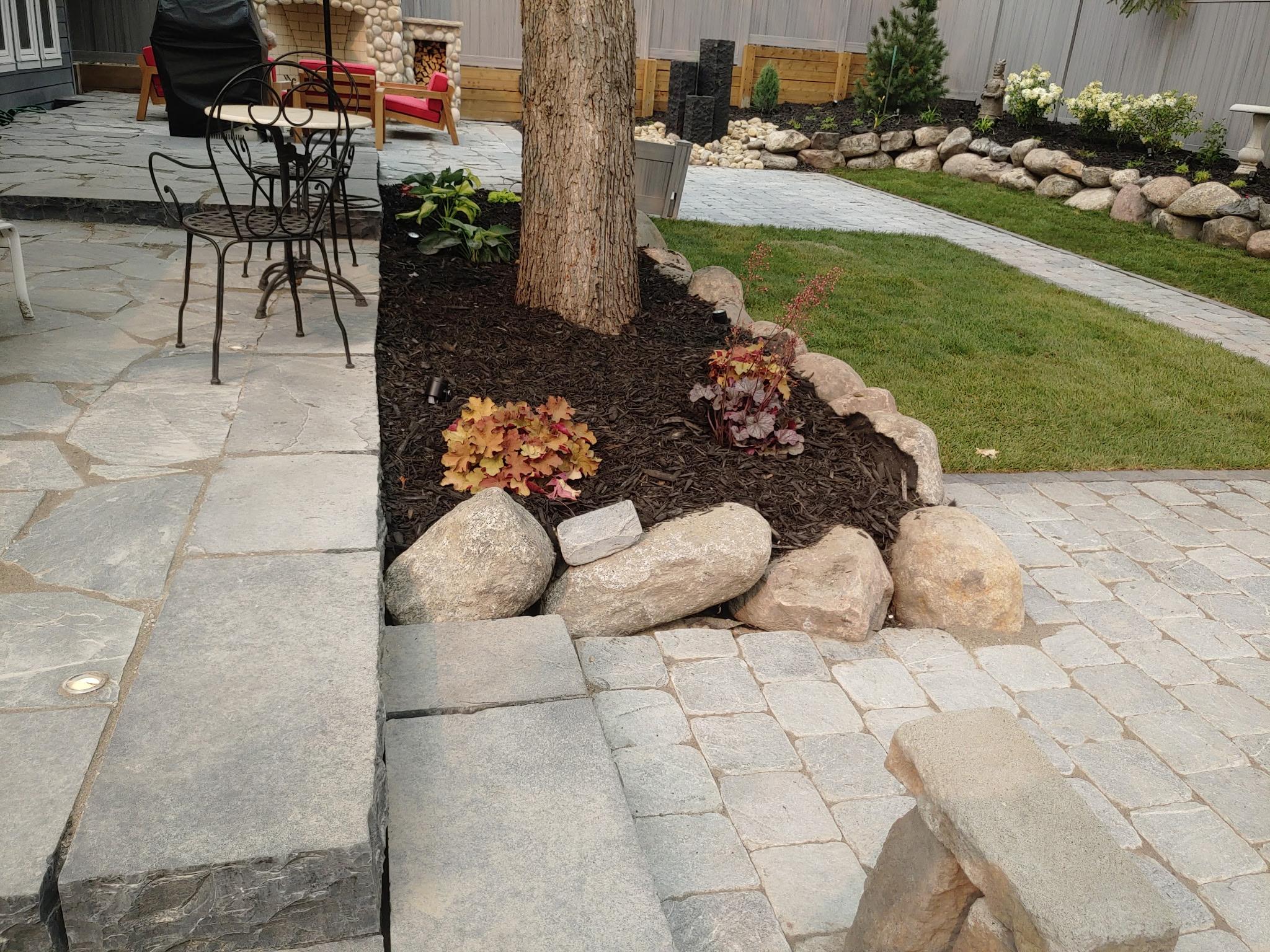 ALA Landscaping completed backyard paver walkway with garden beds